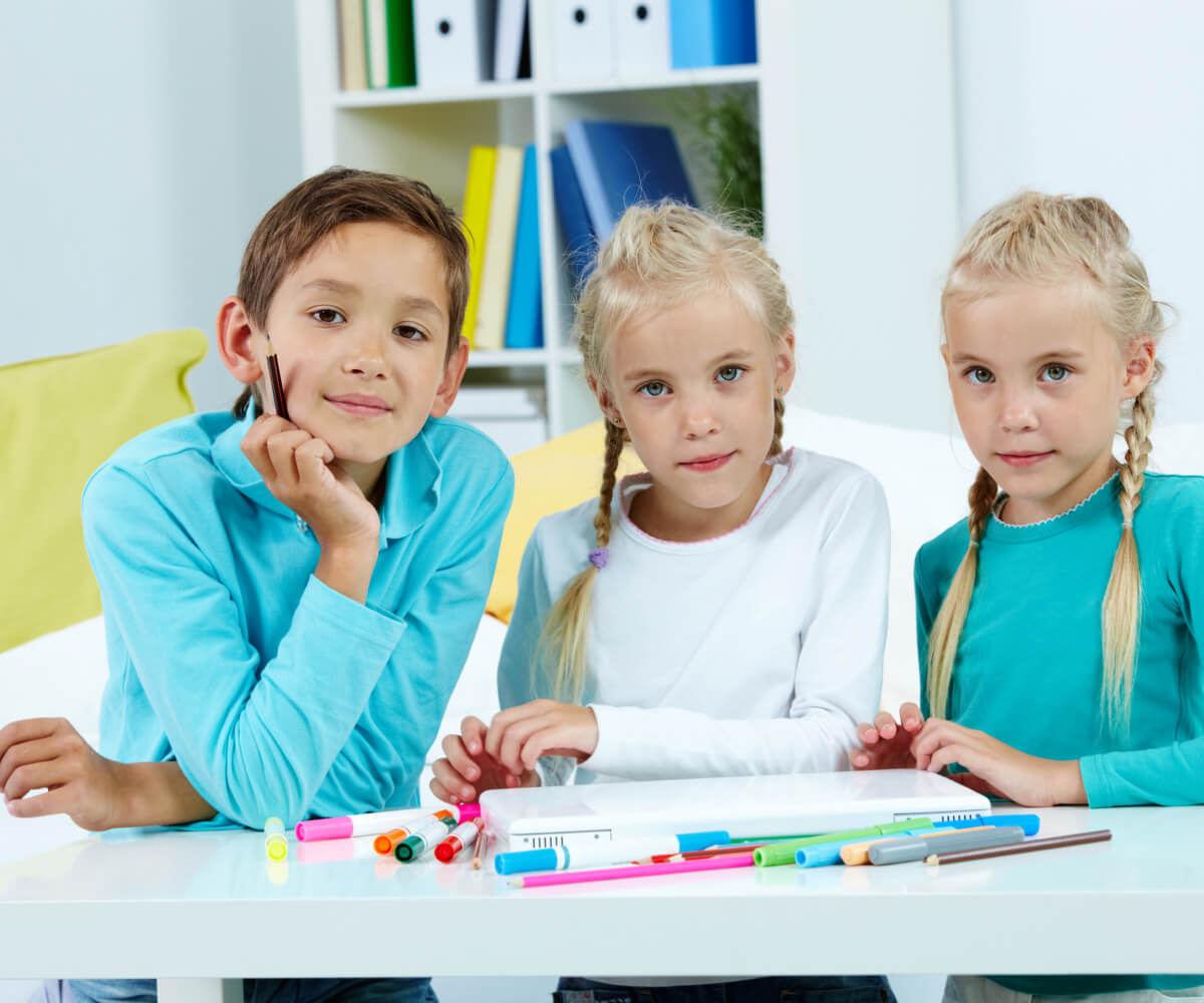 Group of children listening to teacher